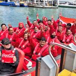 Coca-Cola representatives from INdia get ready to go Jjet boating on Sydney Harbour
